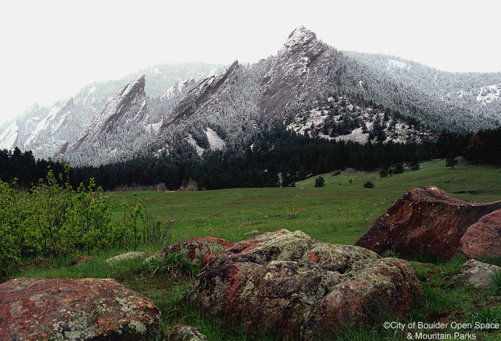 Photo - Snow-dusted Flatirons on a green April morning.